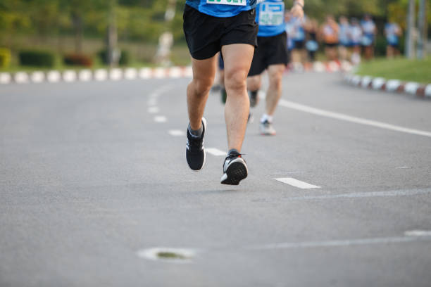 istock Marathon running race, Run up the mountain road. 1166417124