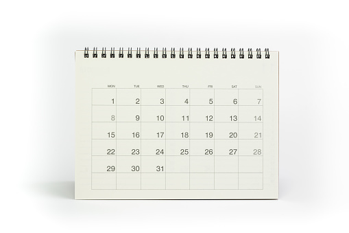 White clean desktop calendar isolated on white background with copy space for month and year using as reminder, planning, schedule or appointment concept.