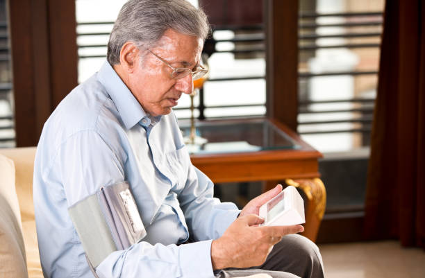 istock Senior man checking his own blood pressure 1166418469