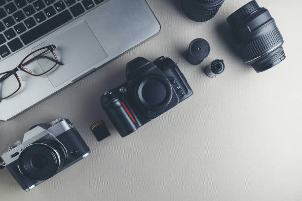 istock Camera, lens and photographer equipment that is ready to work, top view 1166418620