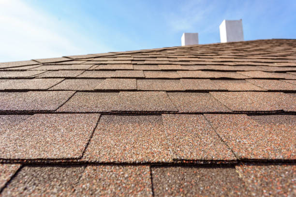 istock Asphalt tile roof with chimney on new home under construction 1166422497