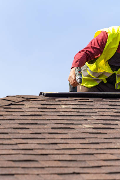 istock Workman install element of tile roof on new home under construction 1166422500