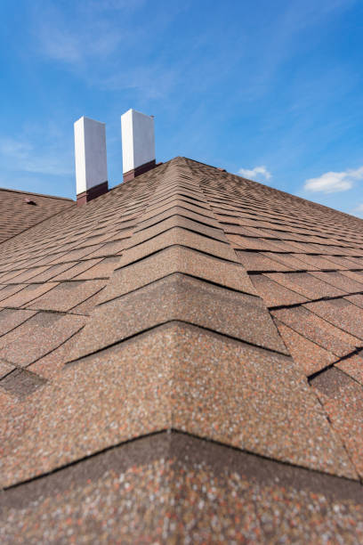 istock Asphalt tile roof with chimney on new home under construction 1166422616
