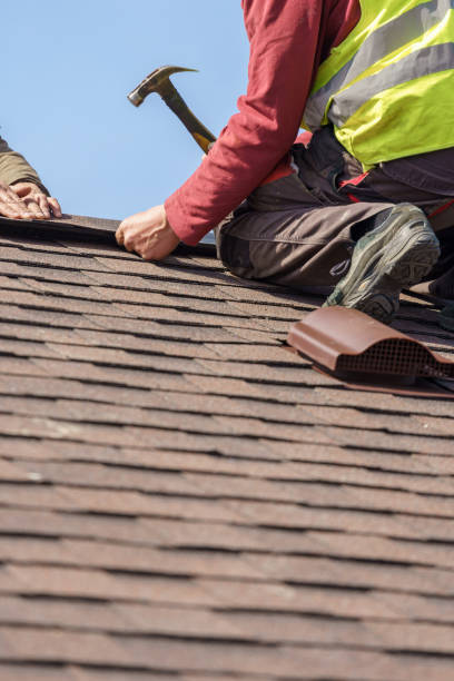 istock Workman install element of tile roof on new home under construction 1166422632