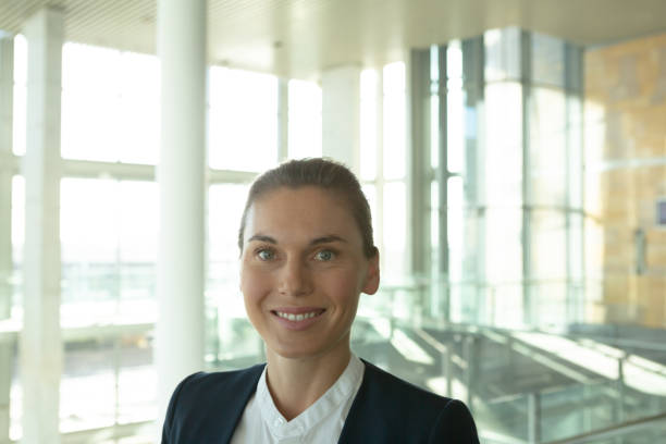 istock Businesswoman looking at camera in a modern office building 1166422959