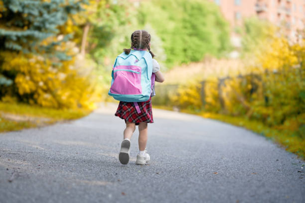 istock Girl with backpack are going to school 1166424084