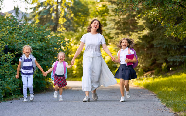 istock Parent and pupils are going to school 1166424086
