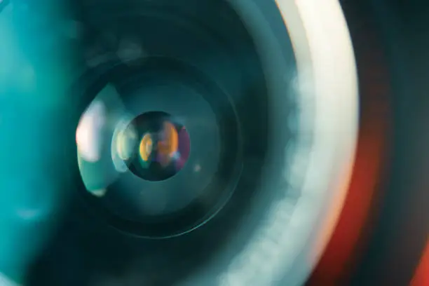 Photo of Camera lens in colorful light