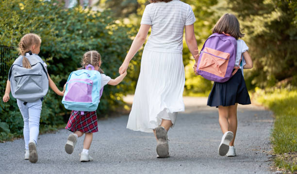 istock Parent and pupils are going to school 1166424126