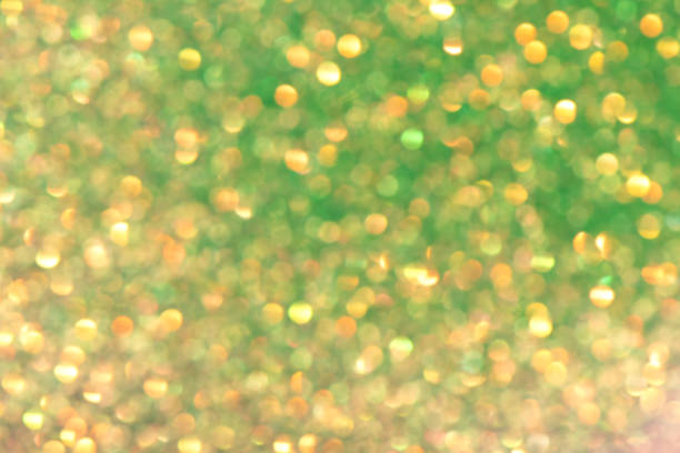 istock Shiny defocused glitter background with color bokeh 1166424354