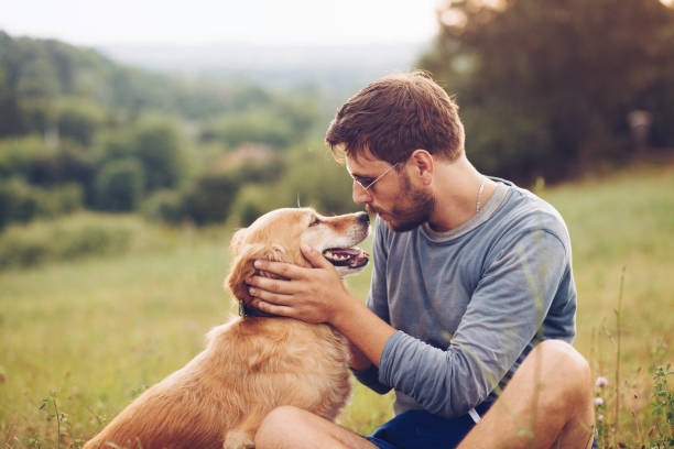 Guy and his dog having a fun in the nature