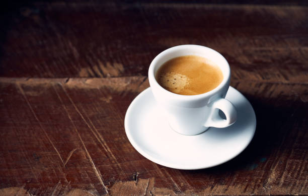 istock Cup of espresso coffee on rustic wooden background 1166424908