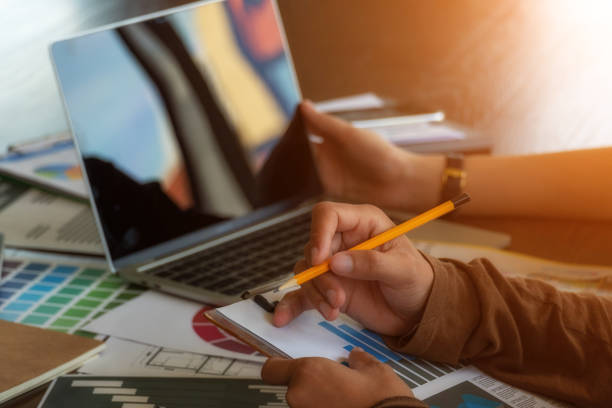 istock Finances and calculate on desk. 1166427354