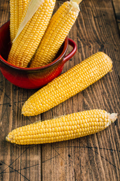 istock Fresh corn on the cob on a wooden background 1166427356