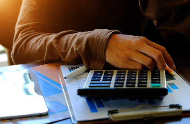 istock Finances and calculate on desk. 1166427675