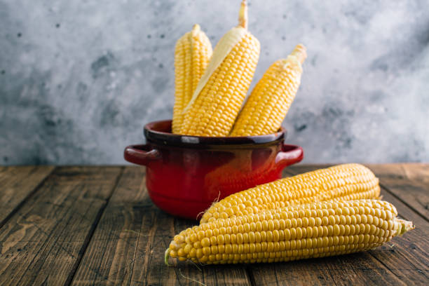 istock Fresh corn on the cob on a wooden background 1166427700