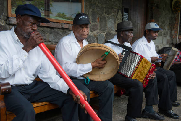 While most Carnival is filled woth loud music from big speakers, sometimes one can enjoy a traditional group, like these men playing rare Jing Pin style Creole music.