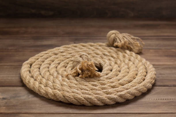 istock ship rope at wooden board background 1166430239