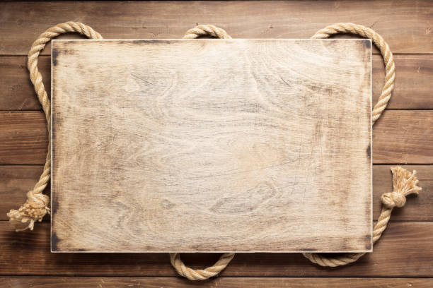 istock ship rope at wooden board background 1166430954