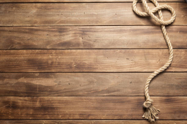 istock ship rope at wooden board background 1166431680