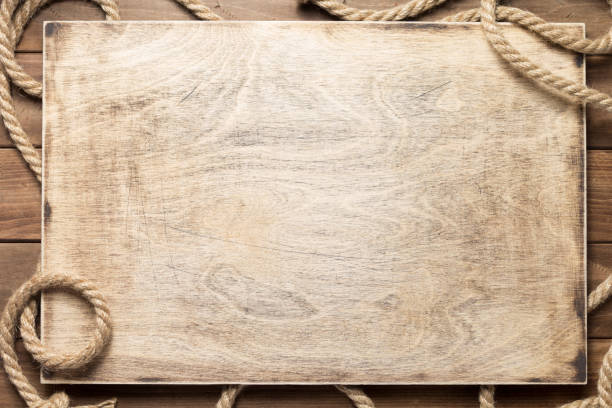 istock ship rope at wooden board background 1166431701