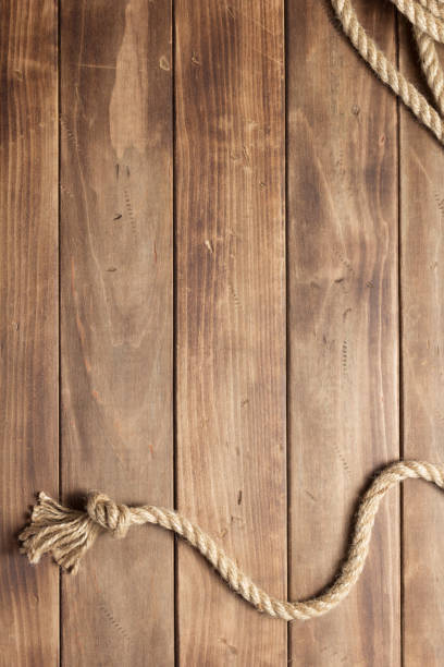 istock ship rope at wooden board background 1166432008