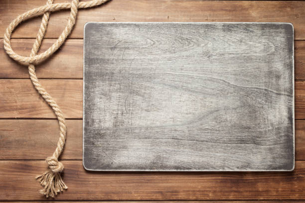 istock ship rope at wooden board background 1166432078