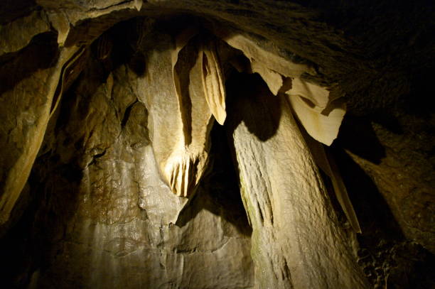 istock in a cave - stalactites and stalagmites 1166433176