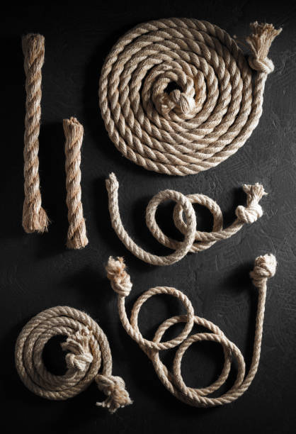 istock ship rope at wooden board background 1166434636