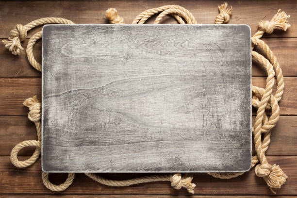 istock ship rope at wooden board background 1166434772