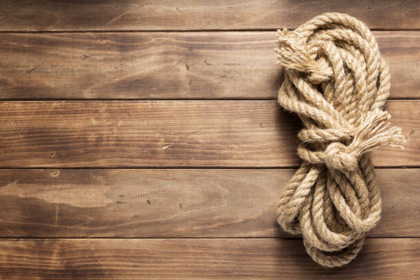 istock ship rope at wooden board background 1166434799