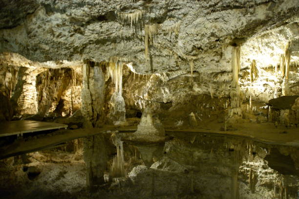 istock in a cave - stalactites and stalagmites 1166434972