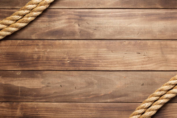 ship rope at wooden board background - lashing imagens e fotografias de stock