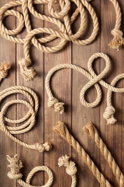 istock ship rope at wooden board background 1166435027