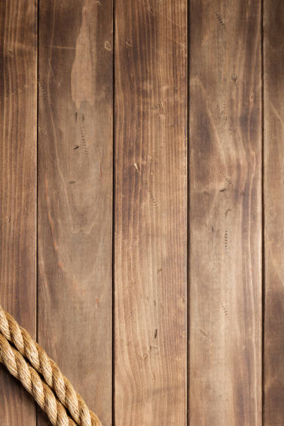 istock ship rope at wooden board background 1166435029