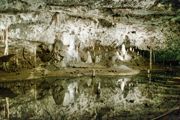 istock in a cave - stalactites and stalagmites 1166435386
