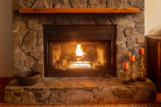 istock Stone fireplace in a cozy mountain cabin. 1166436255