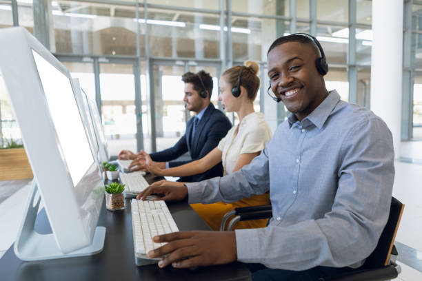 istock Portrait of young man working in a call centre 1166436440