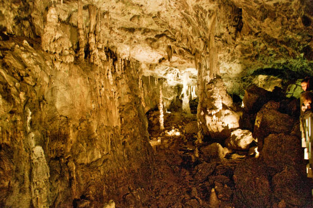 istock in a cave - stalactites and stalagmites 1166436558