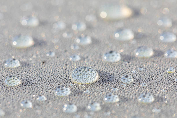 Background design made of water drops on a gray background