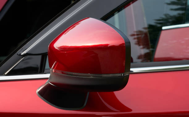 istock side mirror of a red car 1166437956