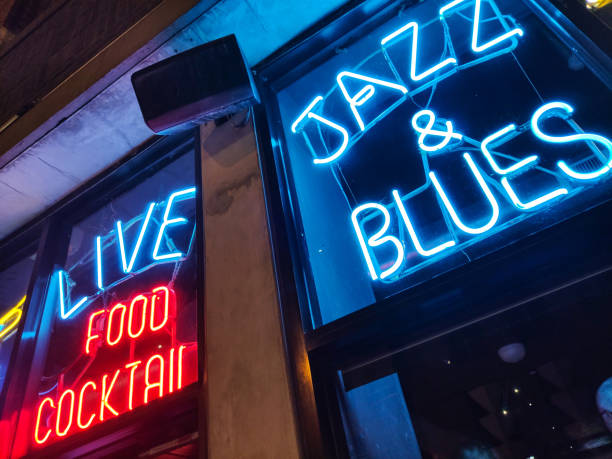 Nightlife in Chicago with Jazz and Blues music. Retro bar with blue and red neon sign. Chicago, Illinois USA. May 10, 2019.  Nightlife with Jazz and Blues music. Retro bar with red and blue neon sign. Food and coctails piano photos stock pictures, royalty-free photos & images