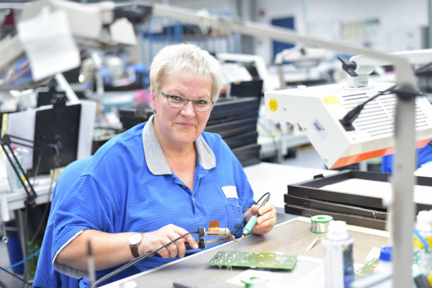 istock friendly woman working in a microelectronics manufacturing factory - component assembly and soldering 1166439286