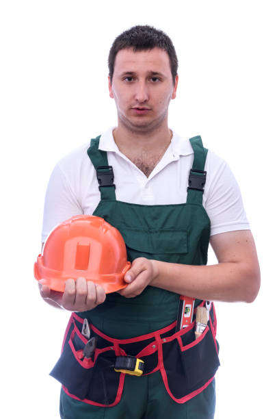 istock Man with helmet in uniform isolated on white 1166439552