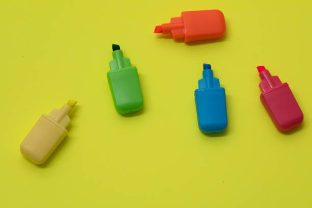 istock Colorful markers against yellow background 1166439583