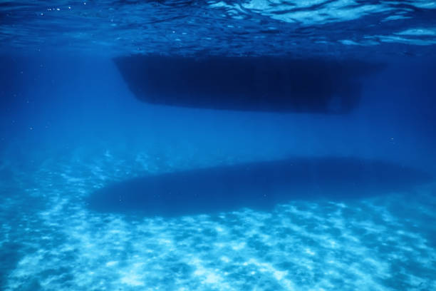 istock Underwater View, Bottom of a Boat, Sun Shine Beam and Rays 1166439608