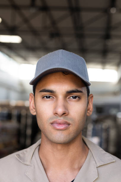 istock Male worker looking at camera in warehouse 1166440007