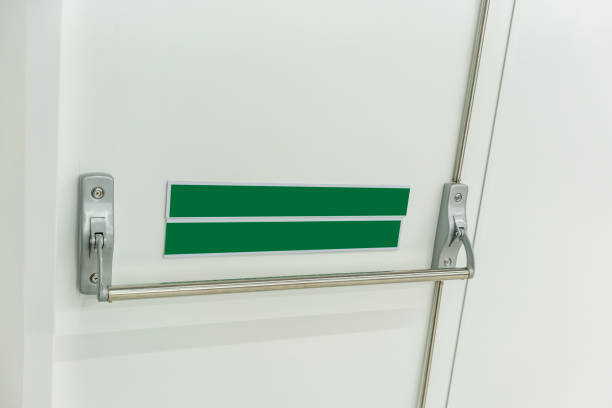 istock Closed up latch and door handle of emergency exit. Push bar and rail for panic exit. 1166442909