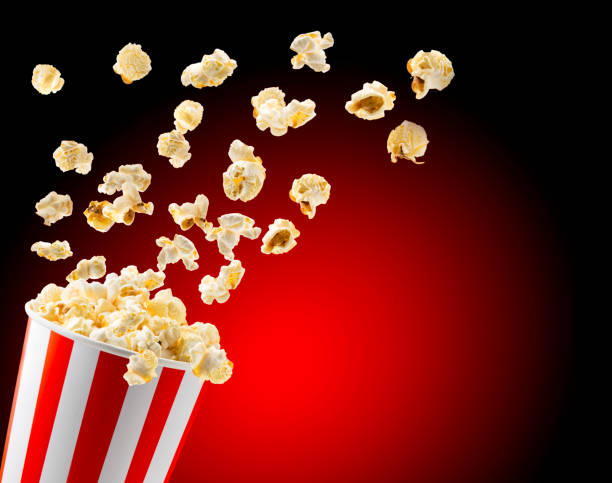istock Popcorn flies from a bucket close-up, a place for text. 1166444891