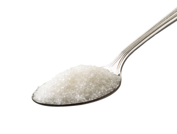istock Sugar in metal spoon closeup on a white. Isolated. 1166444922
